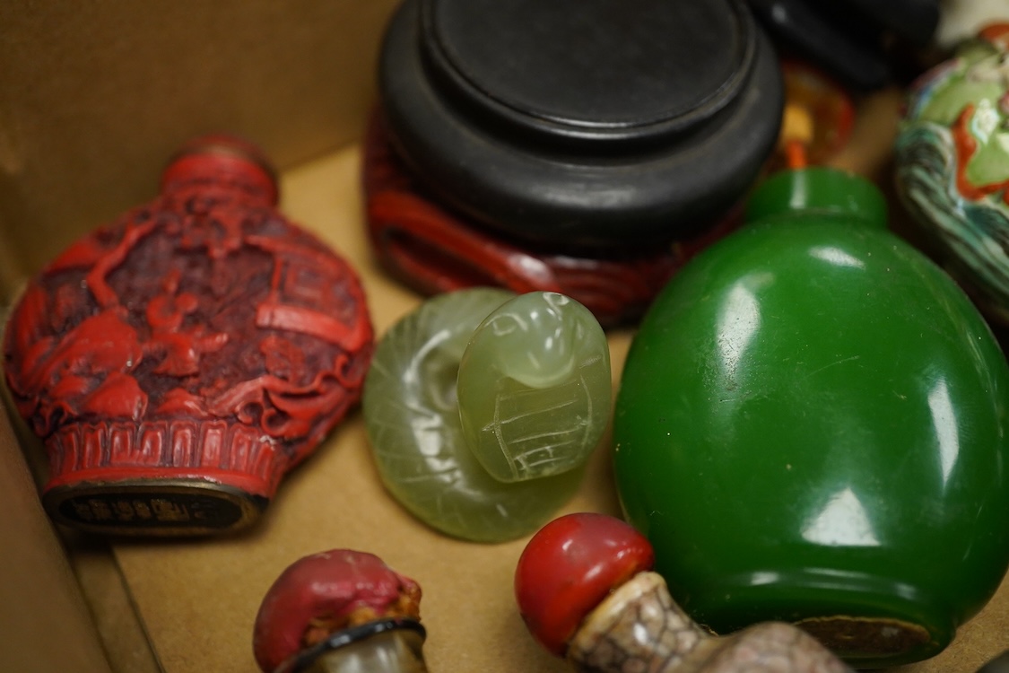 A small collection of Chinese snuff bottles, 19th century and later to include reverse glass painted examples and cinnabar lacquered examples, largest 9.5cm high